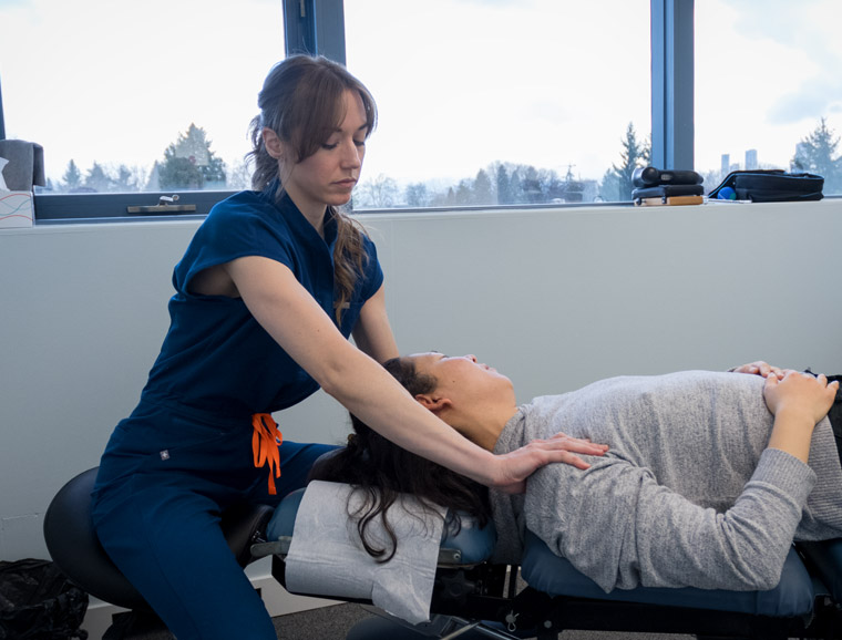 Dr. Kelsey treating patient's headache